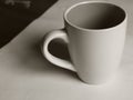 Empty white cup on a light background. Cup with place for text. Copyspace Royalty Free Stock Photo