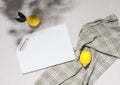 Empty white cutting board ripe lemon lie on the kitchen table, top view flat lay, mockup Royalty Free Stock Photo