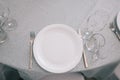 Empty white dinner plate on a table Royalty Free Stock Photo