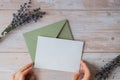 Empty white envelope paper card note template mock up. Copy space for your text. Lavender flower. Greeting or invitation Royalty Free Stock Photo