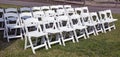 Empty white event chairs