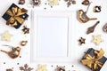 Empty white frame with gold Christmas decorations on a white background with copy space for text. Royalty Free Stock Photo