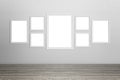 Empty white frames on wall Royalty Free Stock Photo