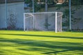 Empty white gate on the football field with green grass. Royalty Free Stock Photo