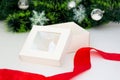 Empty White gift box with red ribbon on white background. Christmas tree garland. Holiday Horizontal template Royalty Free Stock Photo
