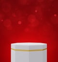 Empty white and gold hexagon podium over red bokeh background Royalty Free Stock Photo