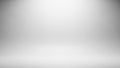 Empty White and Grey Studio Background with Soft Spotlight Effect and Subtle Gradient Keywords: studio, background Royalty Free Stock Photo