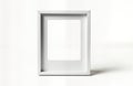 Empty white instant photo frame stands on white background. Simple design. Slight shadow on white surface. Blank frame for adding