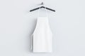 Empty white kitchen apron on hangers. Light background. Chef and cooking concept. 3D Rendering Royalty Free Stock Photo