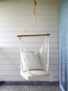 Empty white knitting rope swing hanging from ceiling. Royalty Free Stock Photo