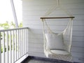 Empty white knitting rope swing hanging from ceiling. Royalty Free Stock Photo