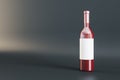 Empty white label glass wine bottle on gray background. Alcohol, winery, beverage and elegance concept. Mock up Royalty Free Stock Photo