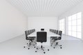 Empty white large meeting room with leather chairs and a table. 3d rendering Royalty Free Stock Photo