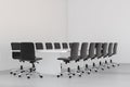 Empty white large meeting room with leather chairs and a table. 3d rendering Royalty Free Stock Photo