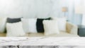 Empty white marble stone table top and blurred living room at home interior with pillow on the sofa background. - can used for Royalty Free Stock Photo