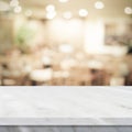 Empty white marble table over blur restaurant background, product and food display montage Royalty Free Stock Photo