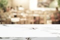 Empty white marble table over blur restaurant background, product and food display montage Royalty Free Stock Photo