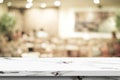 Empty white marble table over blur restaurant background, product and food display montage Royalty Free Stock Photo