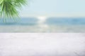 Empty white marble table top with blur sea boekh background. Mockup design for display or montage of product placement. Summer