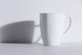 Empty white mug with shadow Royalty Free Stock Photo