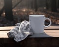 Empty white mug on top of wooden table with dish towel