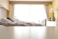 Empty white over bed hospital table background with blurred woman patient lying on bed in hospital Royalty Free Stock Photo