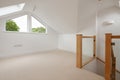 Empty white painted loft attic room and window