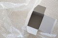 Empty white paper box on air bubble background Royalty Free Stock Photo