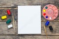 Empty white paper and colorful pencils on wooden table Royalty Free Stock Photo