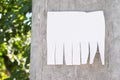 Empty white paper posted on a cement street post and marked with Royalty Free Stock Photo