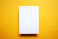 Empty white paper sheet isolated yellow background Royalty Free Stock Photo