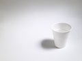 empty white plastic cup on white background
