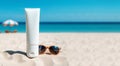 Empty white plastic tube. Sunscreen lotion on sandy beach