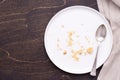 Empty white plate with crumbs on dark wooden background Royalty Free Stock Photo