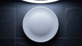 Empty white plate on dark tile background AI-generated Royalty Free Stock Photo
