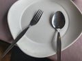 Empty white plate fork and spoon Royalty Free Stock Photo