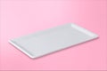 Empty white plate on gradient pink rose background Royalty Free Stock Photo