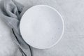 Empty white plate on gray concrete stone background Royalty Free Stock Photo