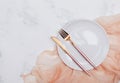 Empty white plate and modern design cutlery on the white marble table Royalty Free Stock Photo