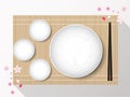 Empty white plate set with chopsticks on a bamboo cover. Vector Royalty Free Stock Photo