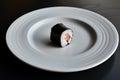 empty white plate with a single piece of sushi in the center Royalty Free Stock Photo