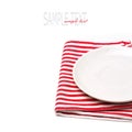 Empty white plate on tablecloth Royalty Free Stock Photo