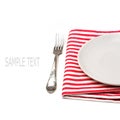 Empty white plate on tablecloth with fork Royalty Free Stock Photo