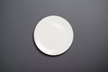 Empty White Plate, Top View on Grey Backround, Empty Space Royalty Free Stock Photo