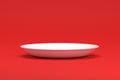 Empty white plate on Velvet red background- Clean Side view Royalty Free Stock Photo