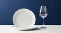 Empty White Plate and Wine Glass on Table Royalty Free Stock Photo