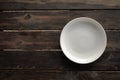Empty white plate on a wooden loft table Royalty Free Stock Photo