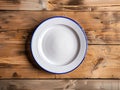empty white plate on wooden table Royalty Free Stock Photo
