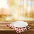 Empty white plate on wooden table Royalty Free Stock Photo