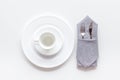 White plates and cup for table setting on white background top view mockup Royalty Free Stock Photo